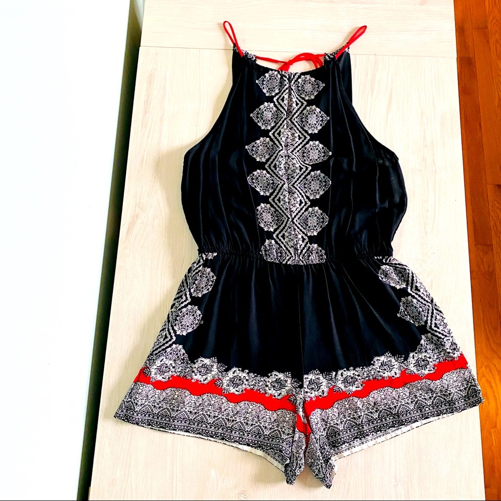 Sweet wanderer brand Women’s short Romper in a size Medium. Black red and white.